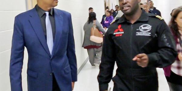Congressman Johnson speaks with pilot Barrington Irving during their visit to MLK Jr. HS in DeKalb County, GA in October 2017.