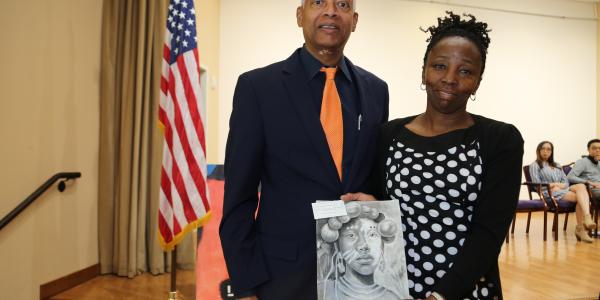 Rep. Johnson stands with grand prize winner Arantza Pena Popo’s mother Maria Popo and the winning piece “Cultural Portrait” during the reception. Arantza was attending a college preparatory class and could not attend the Saturday event. 