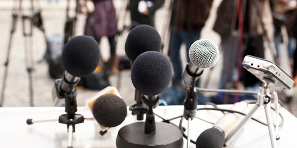 Microphones at a news conference