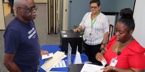 Gentleman in Vets for Democracy Shirt Working with State Department