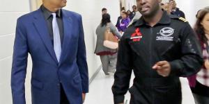 Congressman Johnson speaks with pilot Barrington Irving during their visit to MLK Jr. HS in DeKalb County, GA in October 2017.